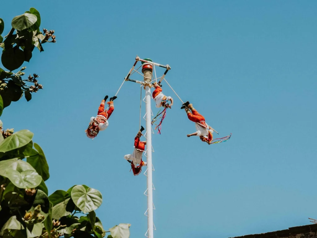 papantla flyers performing in playa del carmen