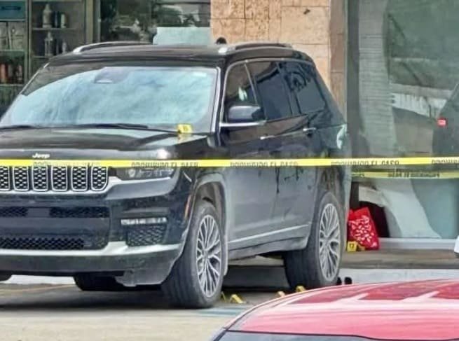 a black SUV surrounded by police tape