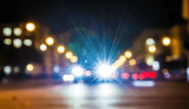 car at night with lights on