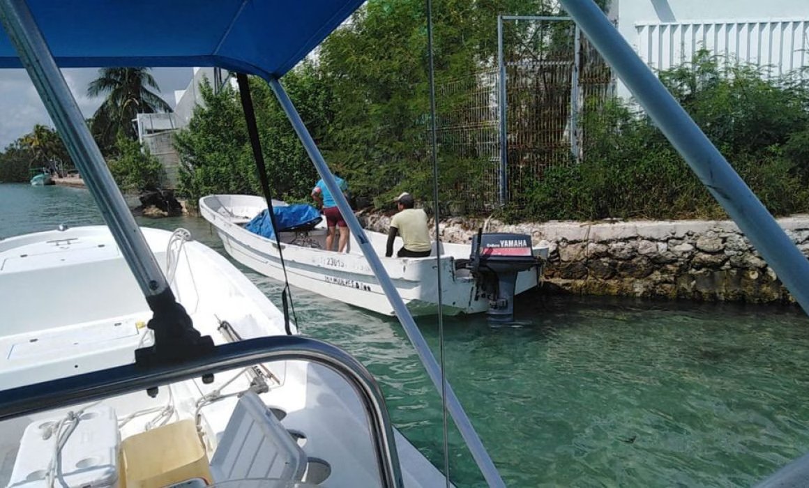 two boats on calm water with one person on each boat-23102025