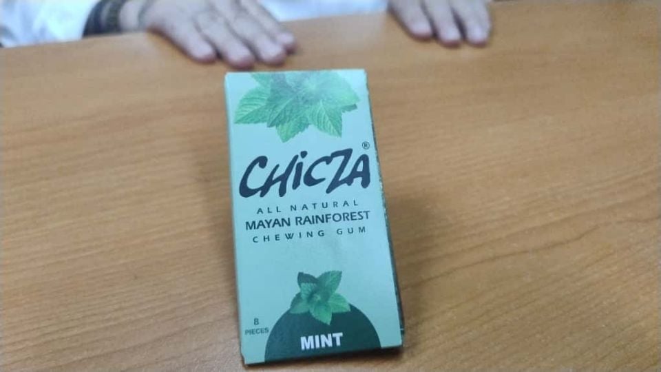A box of Chicza all natural Mayan rainforest chewing gum in mint flavor placed on a wooden table