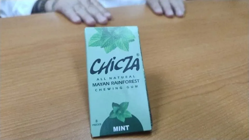A box of Chicza all natural Mayan rainforest chewing gum in mint flavor placed on a wooden table