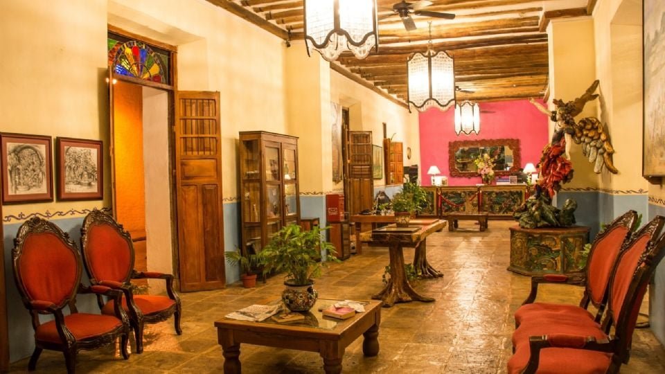 a beautifully decorated hallway featuring antique furniture and vibrant artwork-21102025