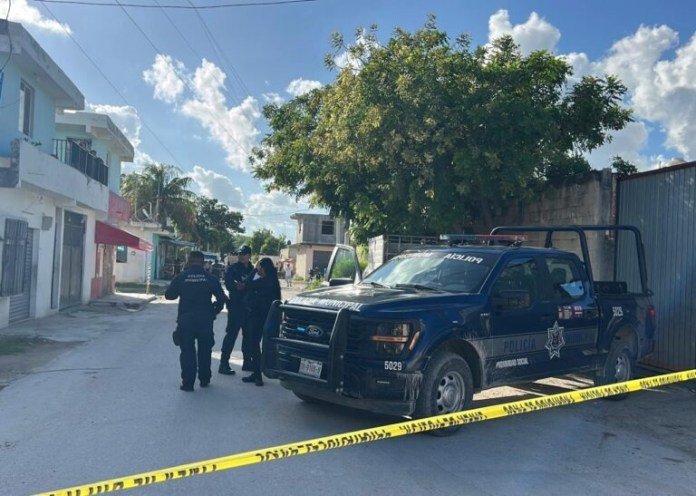 A police truck and officers are gathered at a scene in a residential neighborhood with yellow tape blocking the area.$# CAPTION