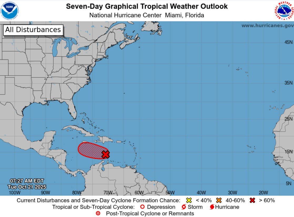 Map showing the seven-day tropical weather outlook by the National Hurricane Center with a highlighted area in the Caribbean indicating a disturbance potential area.$# CAPTION