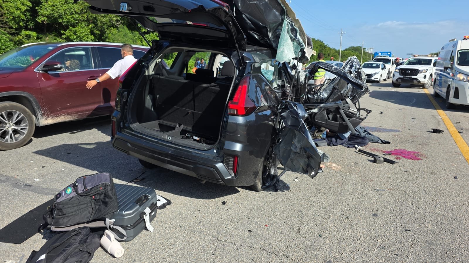 Emergency responders at the scene of a multi-vehicle crash on the Playa del Carmen-Tulum highway