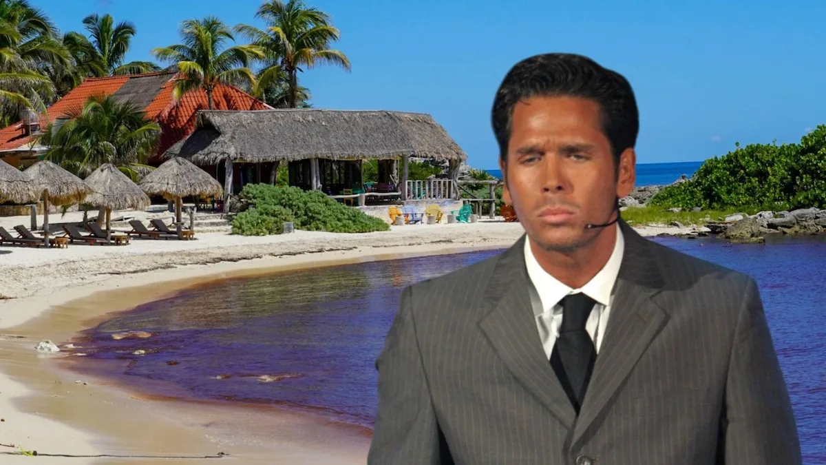 a man in a suit standing with a beach resort background-26112025