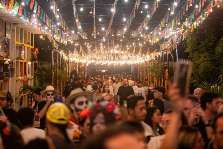 A vibrant crowd celebrating in a festive atmosphere, adorned with colorful lights and decorations.$#$ CAPTION