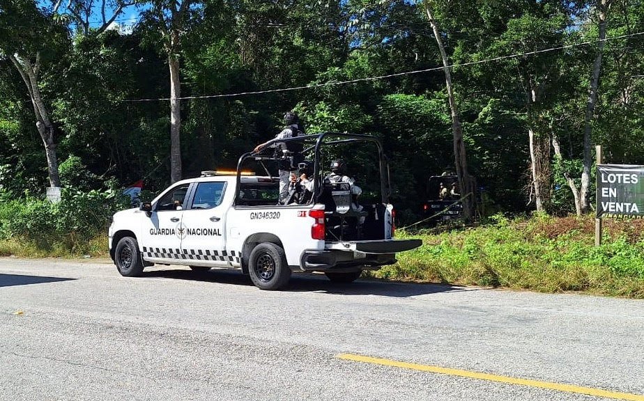 Authorities at the scene where bodies of two brothers were found in Felipe Carrillo Puerto