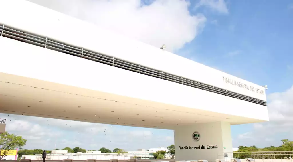 Exterior view of the Fiscalía General del Estado building featuring modern architecture and a clear sky