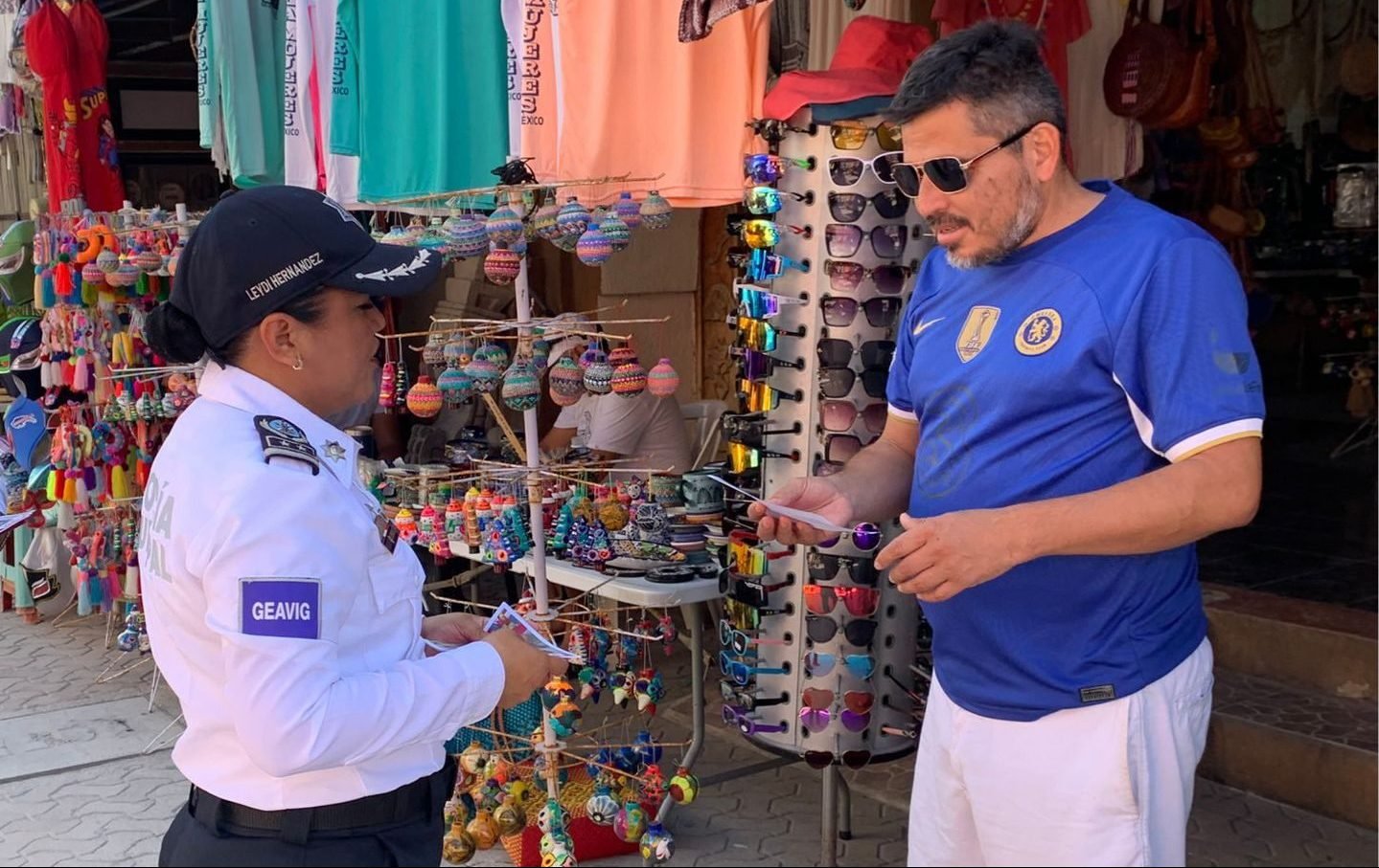 Officials distributing informational materials for the Zero Fireworks Campaign in Isla Mujeres