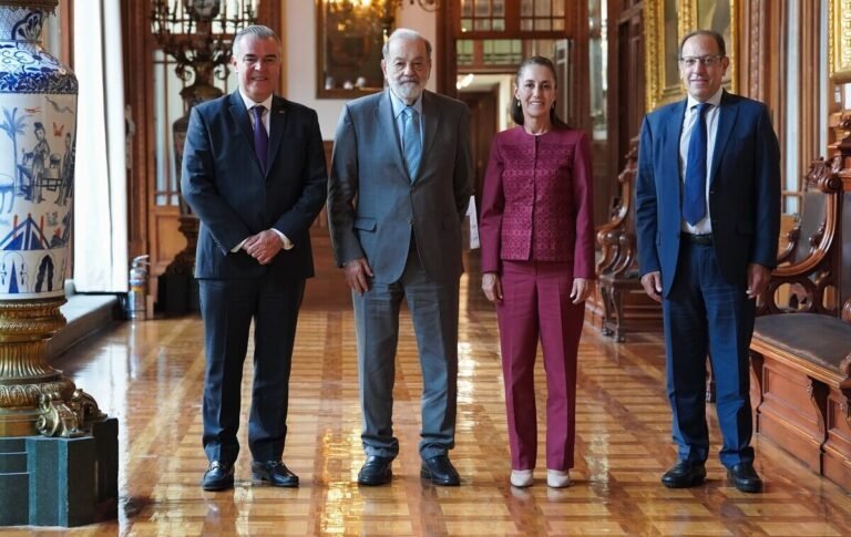 four individuals standing together in a decorated indoor space-25112025