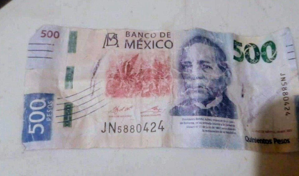 A worn Mexican 500 peso note showing the Banco de Mexico logo and a historical figure on the front