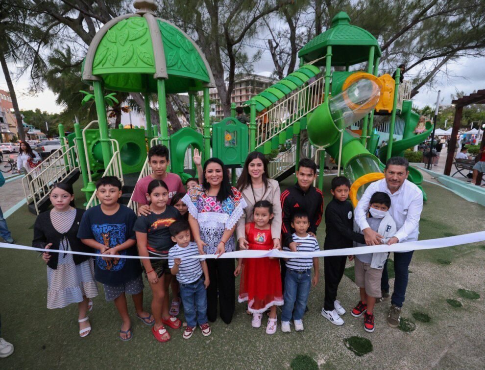 Children playing on new playground equipment in Puerto Morelos