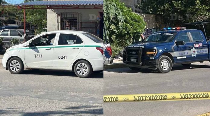 Police officers at the scene in Cancún where a taxi driver died and a bagged body was found