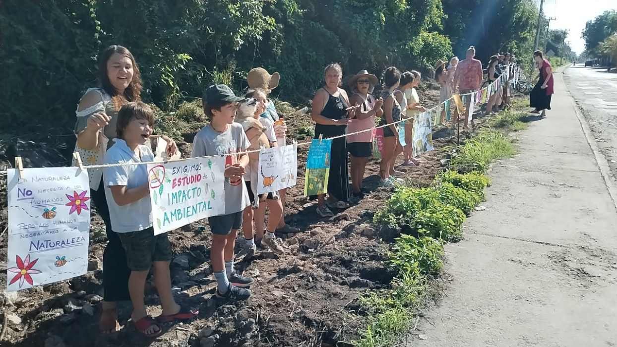 Residents protesting with signs against Bepensa's deforestation in Xcalacoco, Playa del Carmen