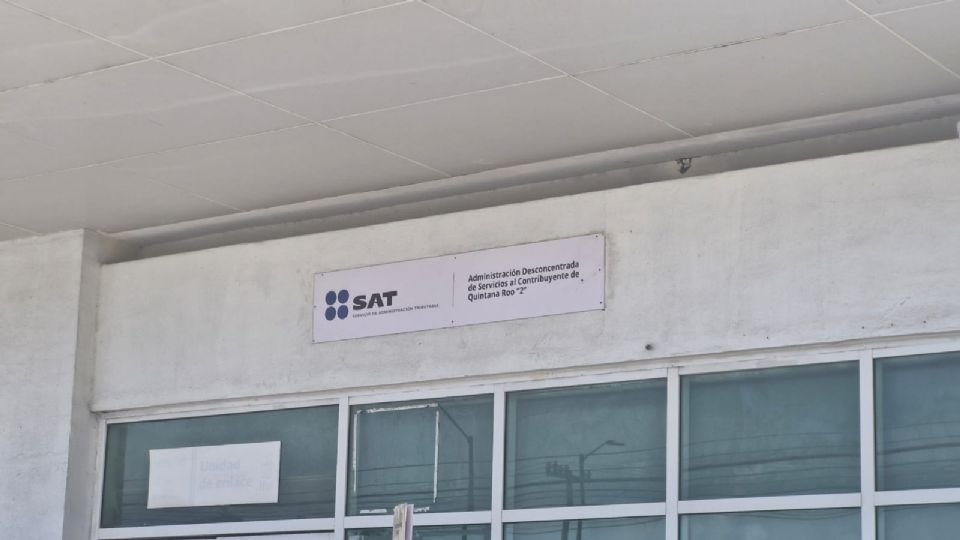 exterior view of the tax administration office with a sign on the wall