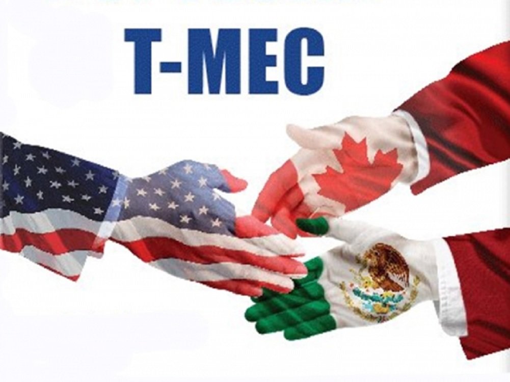 Hands painted with the flags of the USA, Canada, and Mexico reaching out in partnership under the banner T-MEC