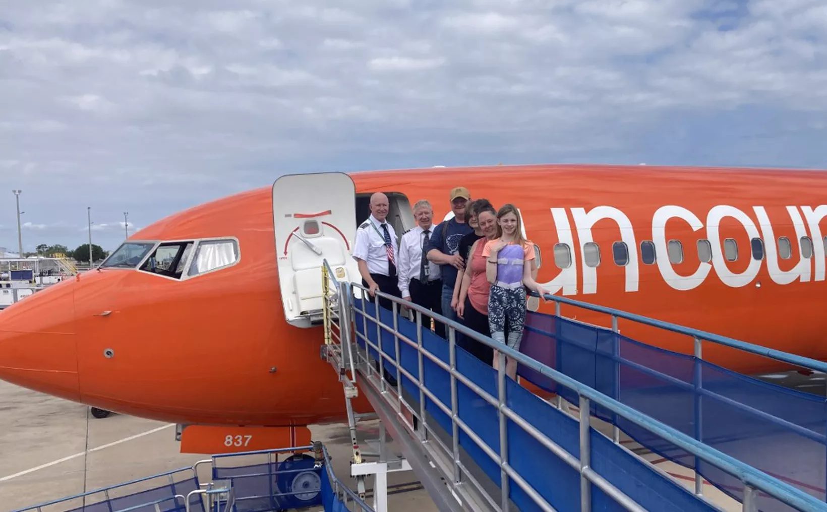 Aerial view of Cancún International Airport with airplanes