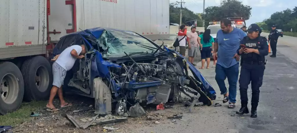 Damaged car after crashing into trailer on Highway 307 near Tulum
