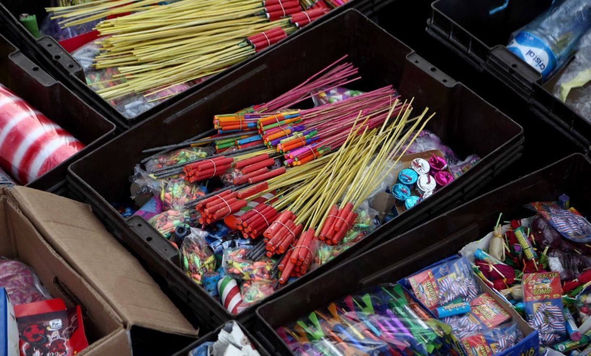 Fireworks exploding in the night sky over Cozumel