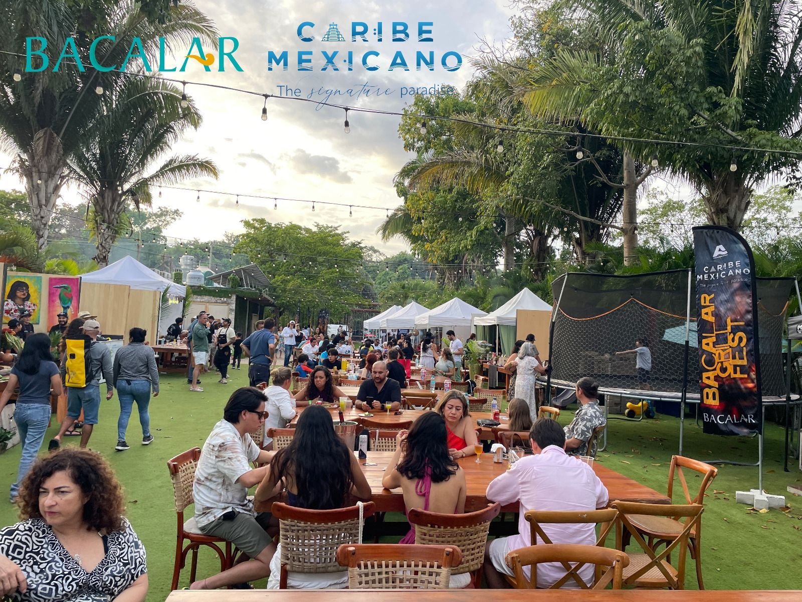 Attendees enjoying food at the First Caribbean Mexican Barbecue Festival in Bacalar