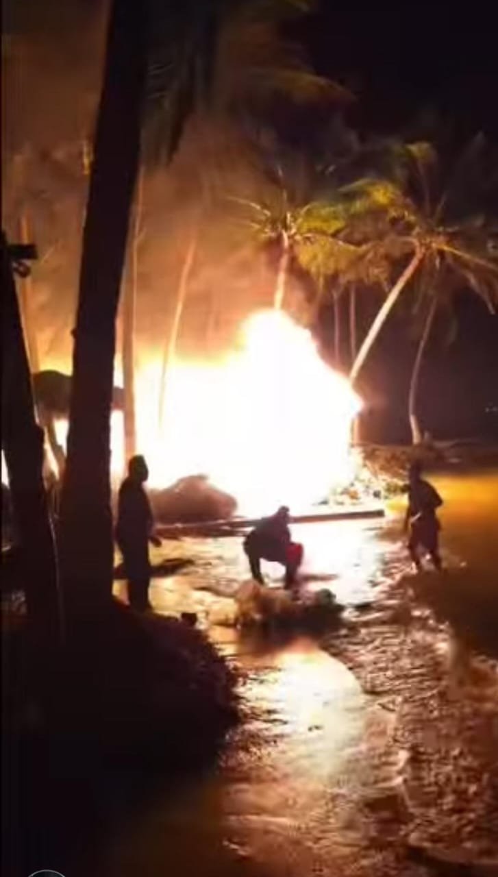 Fire damage to palapas on Mahahual beach
