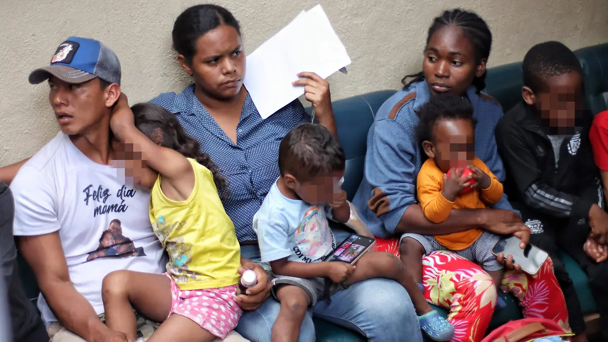 Migrants waiting in line at an asylum processing center in Mexico