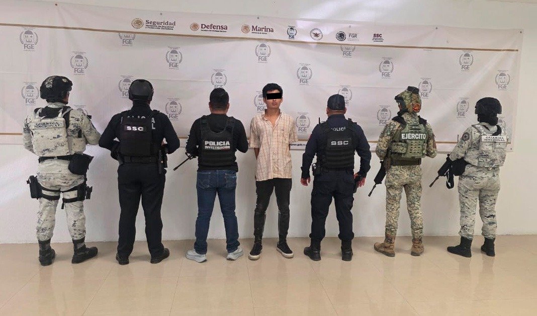 Police and forensic investigators at the crime scene in Playa del Carmen