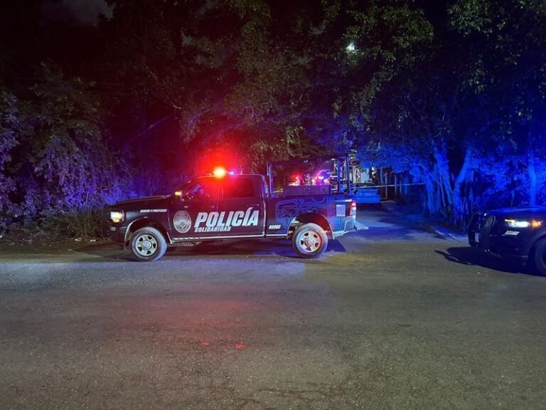 Police and paramedics at the scene of a homicide in Playa del Carmen