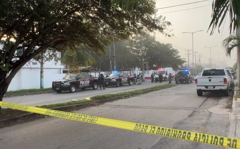 Police officers at the scene of a shooting in Chetumal