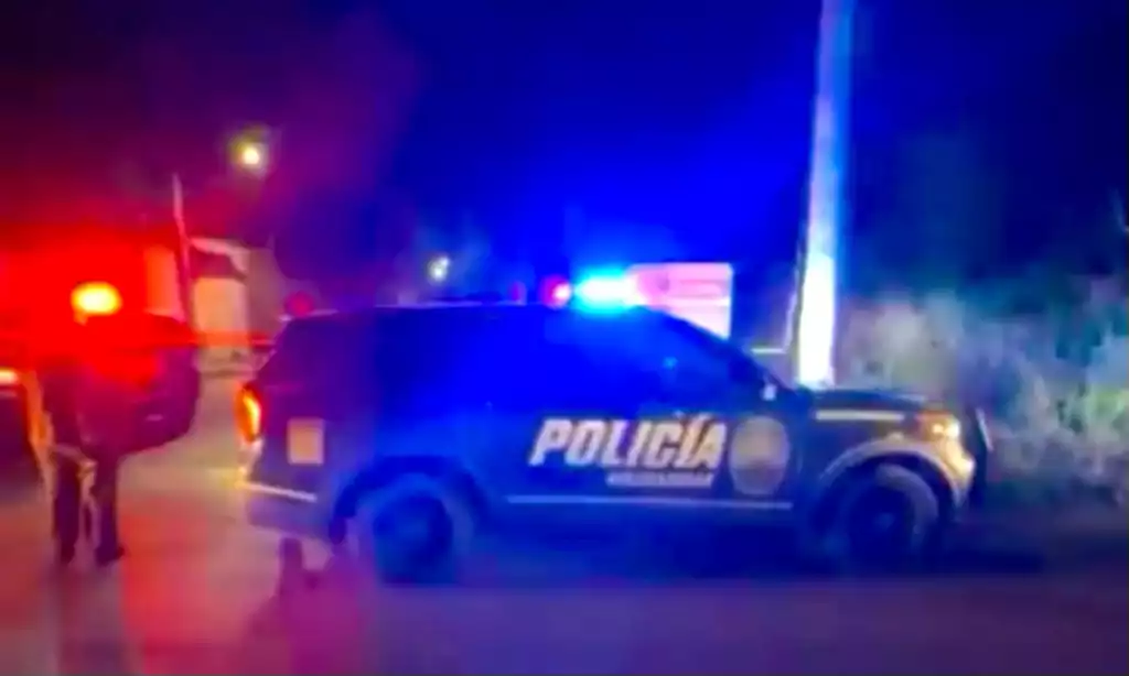 Police officers securing the crime scene where a man was found dead in Playa del Carmen