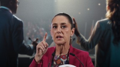 President Claudia Sheinbaum addressing reporters at a press conference