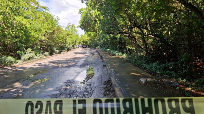 Police investigation at Punta Sam highway where body was found