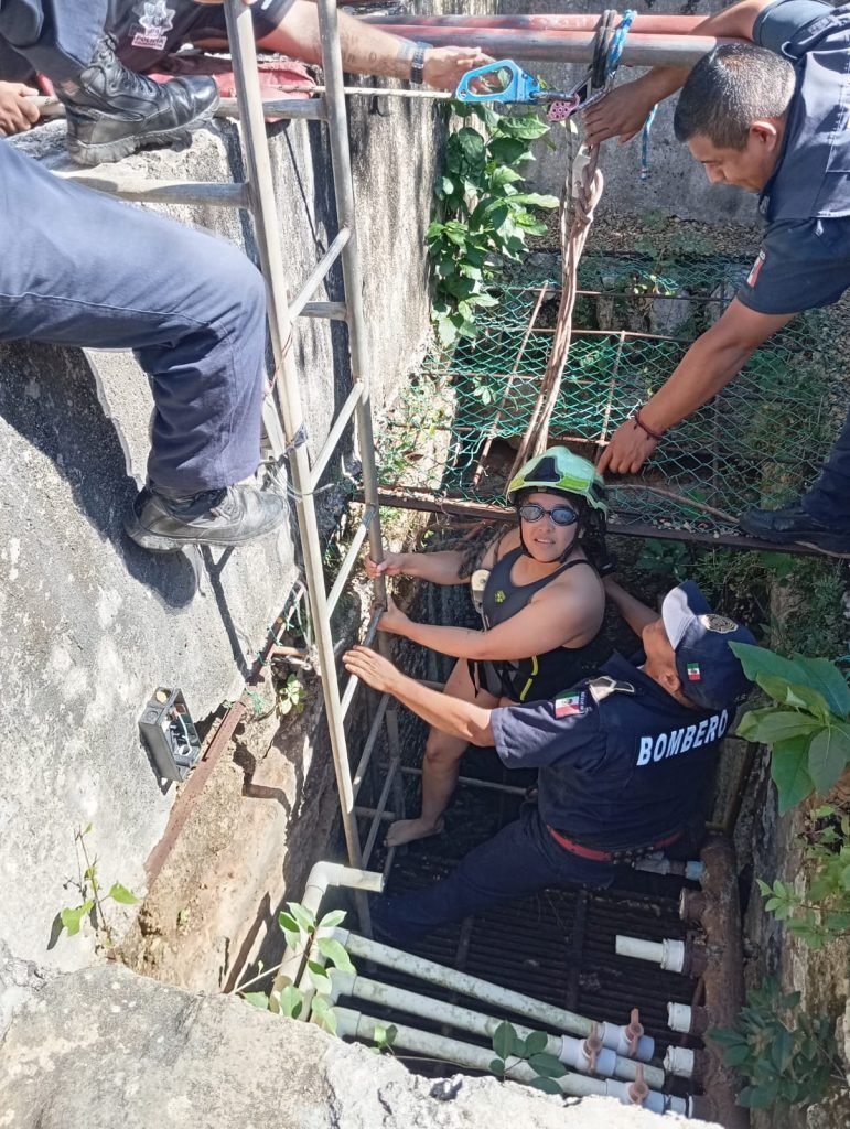 Firefighters and police personnel conducting a rescue operation at the Sambulá cenote in Motul, Yucatán.