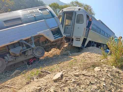 Rescue personnel working at the site of a train derailment in Oaxaca, Mexico.