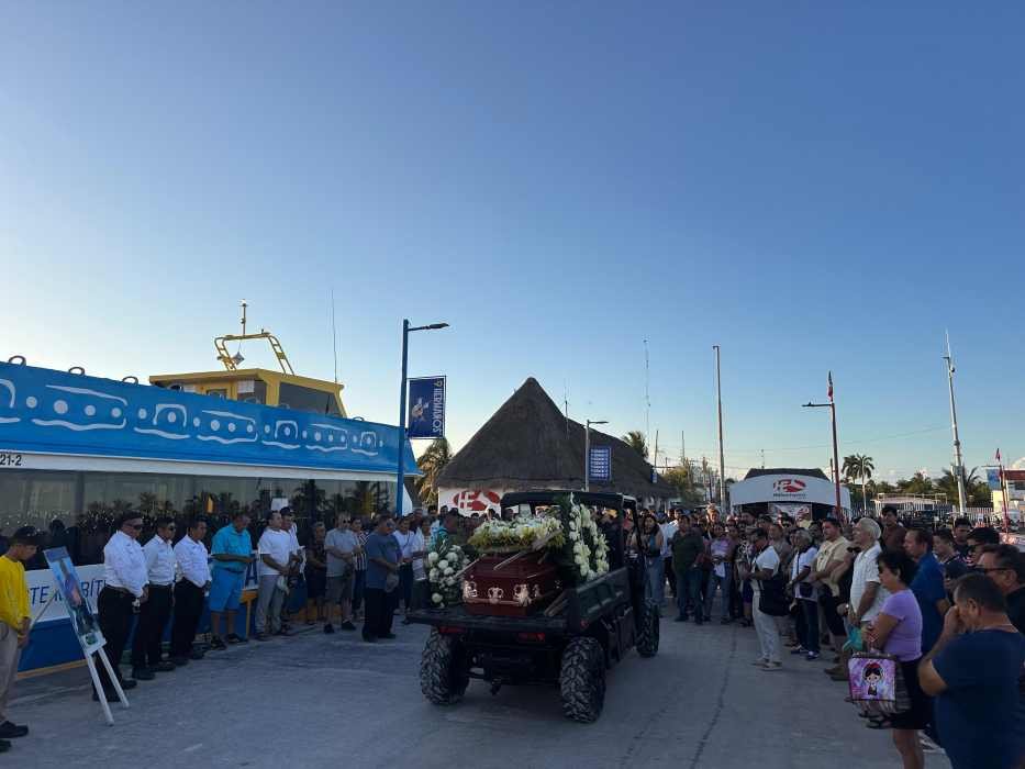 Amauri Mena's coffin being transported on an all-terrain vehicle in Holbox