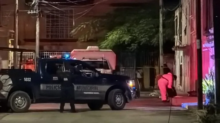 Police and emergency responders at the scene of a shooting in Cancún
