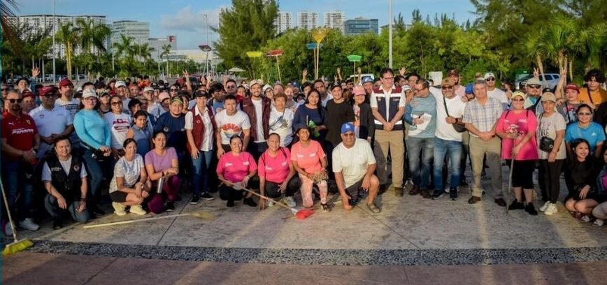 Volunteers and officials participate in a cleanup at Tajamar Boardwalk in Cancún to protect the Nichupté Lagoon System