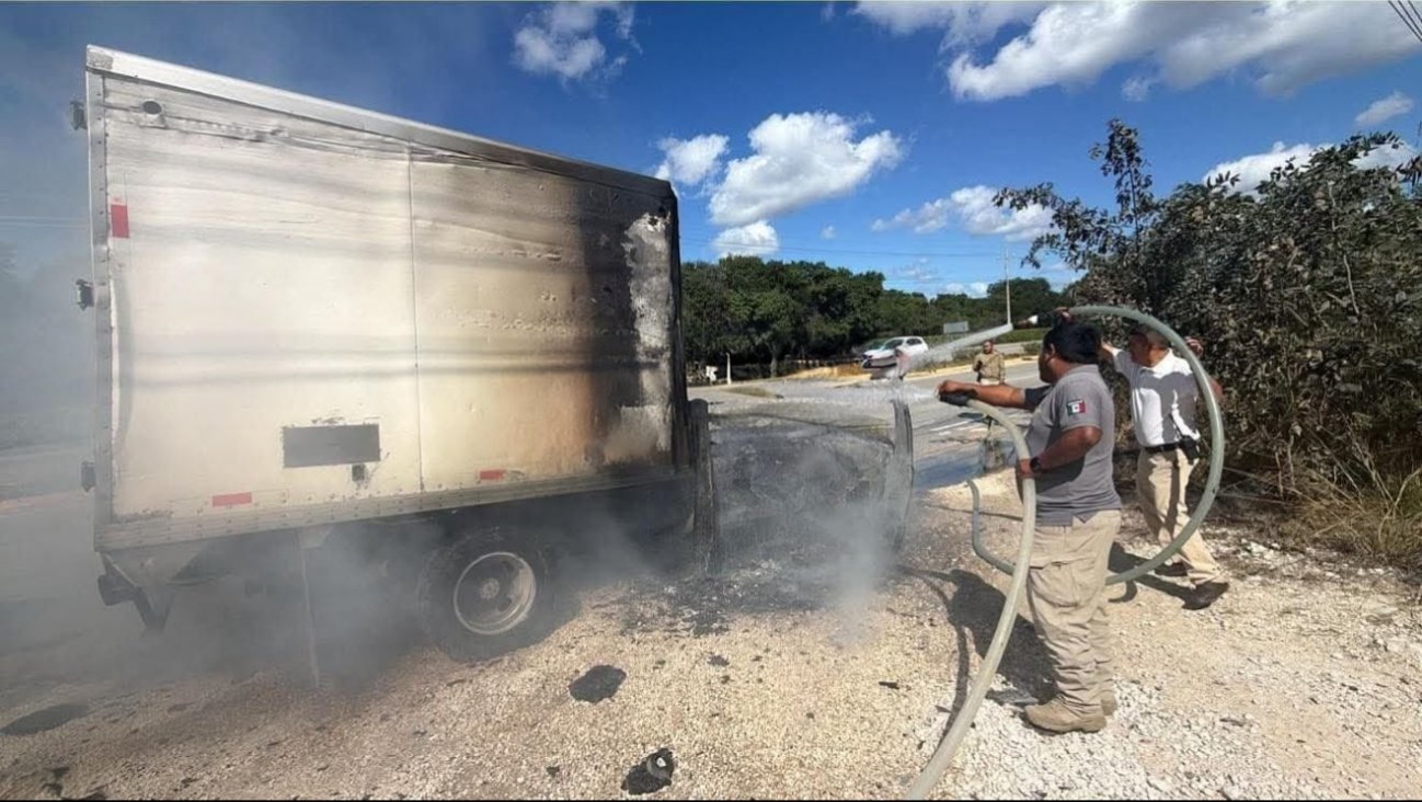 A cargo truck engulfed in flames on the Playa del Carmen-Tulum highway near Bahía Príncipe resort