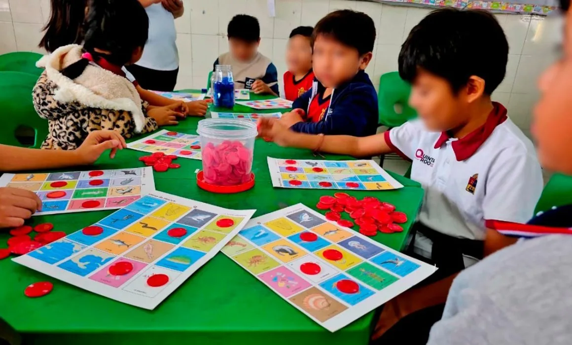 Students participating in environmental education activities at a fair in Cozumel