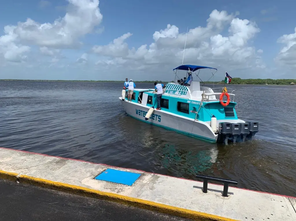 Aerial view of maritime vessels traveling between Belize and Chetumal across Chetumal Bay