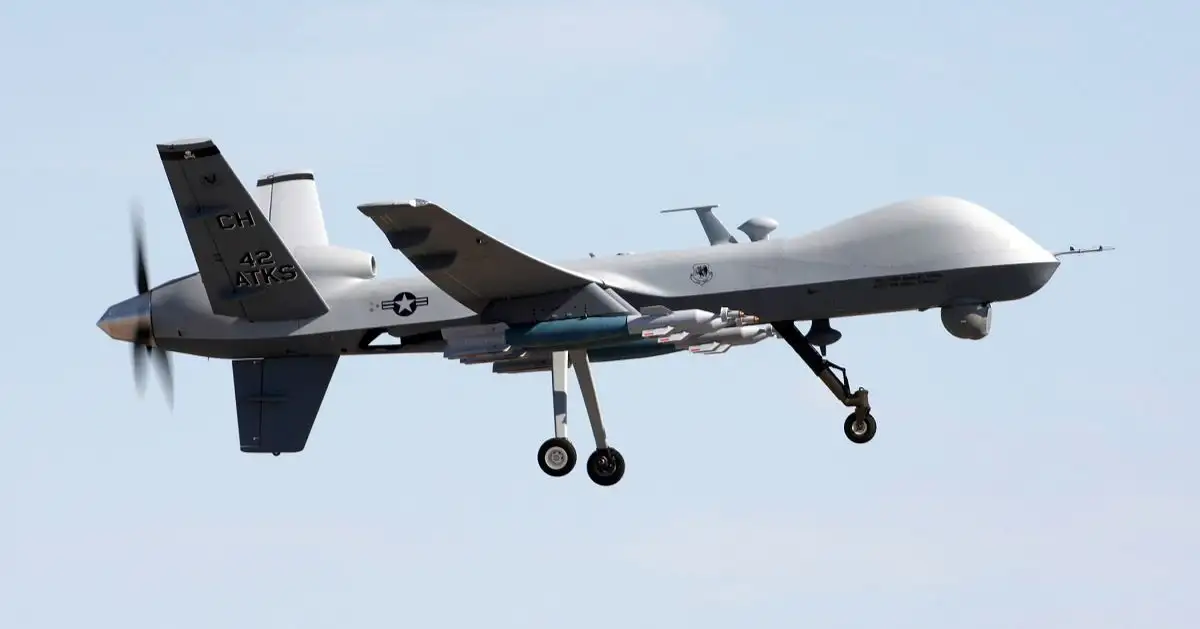 An MQ-9 Reaper drone, a U.S. military surveillance aircraft, flying over the Caribbean Sea near the Yucatán Peninsula.