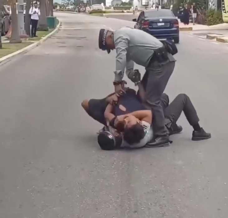 National Guard officers detaining a man in Cancún's Hotel Zone