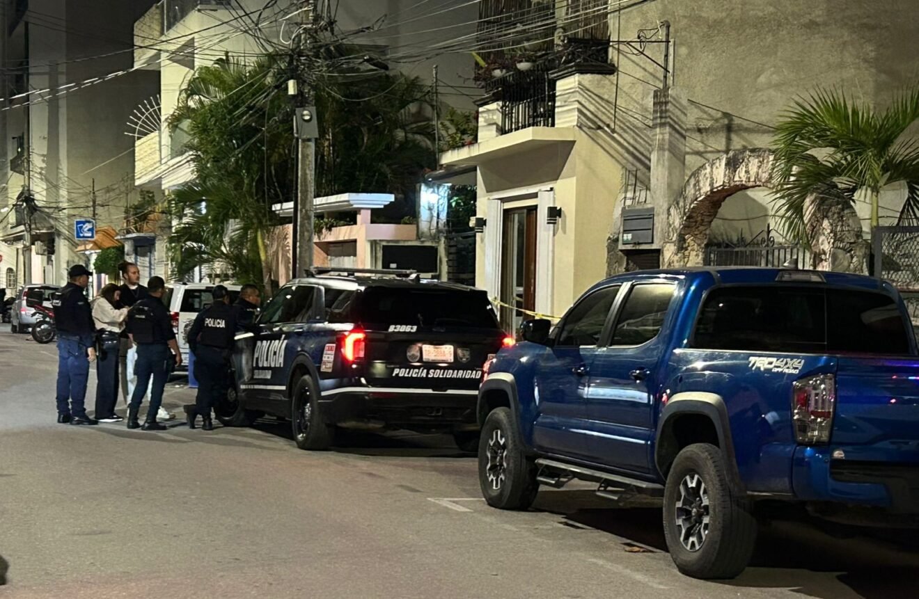 Police and forensic investigators at the scene where a woman was found dead in Playa del Carmen