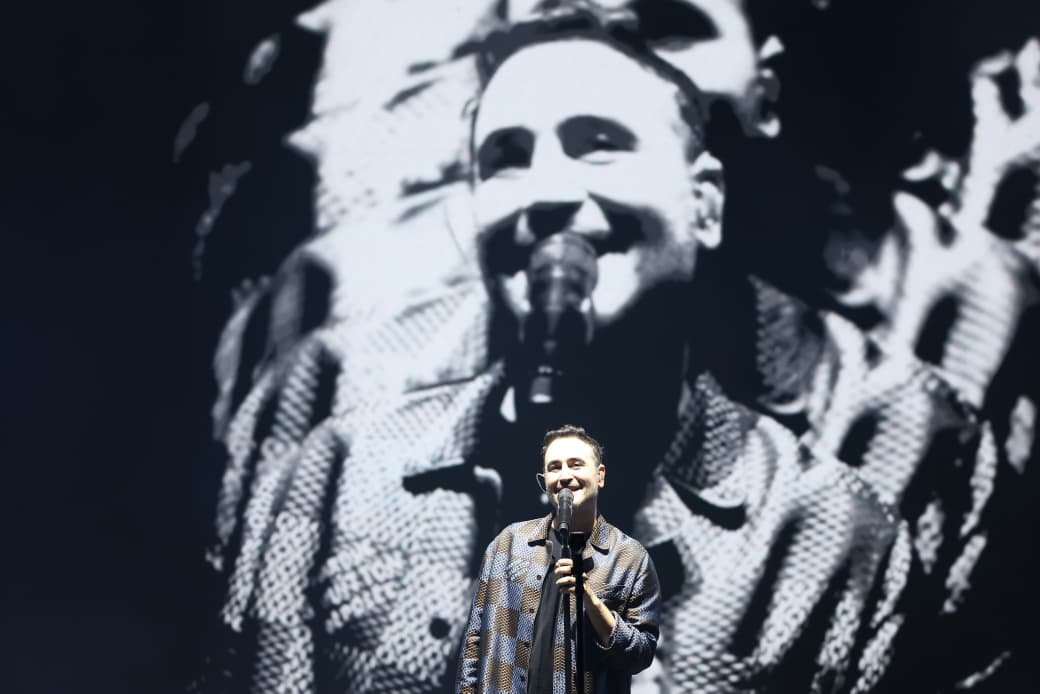 The Mexican band Reik performing on stage at Plaza Grande during Mérida Fest, with a large crowd in attendance.