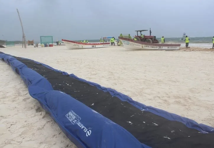 Sargassum barrier being installed on a beach in Mahahual, Costa Maya
