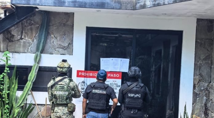 Authorities conducting a raid on a home in Tulum's Guerra de Castas neighborhood