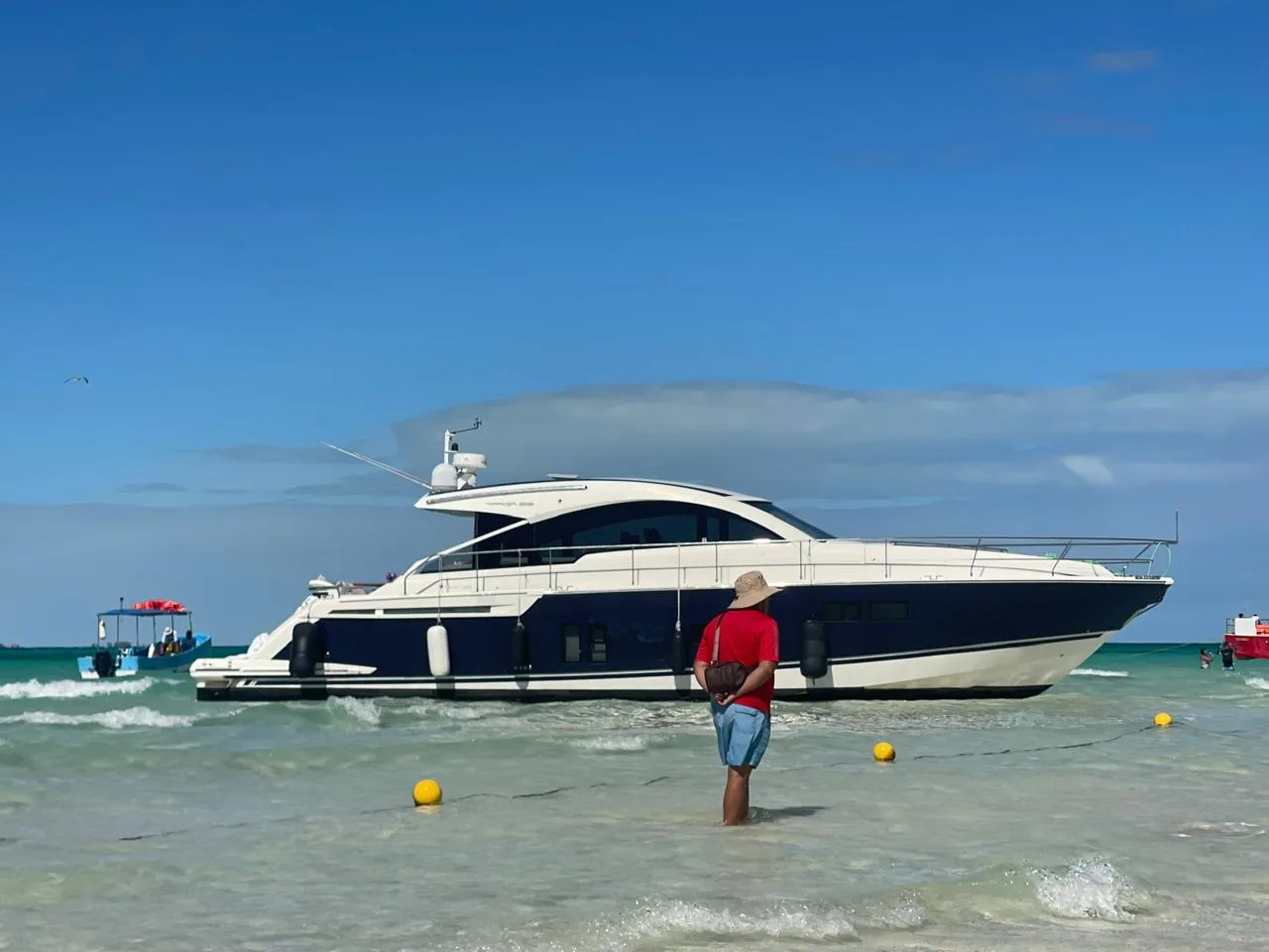 A yacht stranded on the sandy beach of Playa Norte in Isla Mujeres