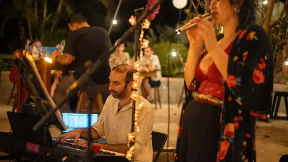 Young Maya musicians performing at a cultural event in Cancún, Quintana Roo